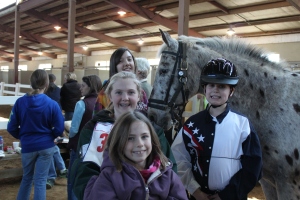the Rockbridge Hunt Pony Club girls cheer on the Special Olympics!