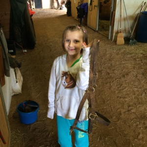 One of our young volunteers is excited about helping train horses for April lessons.